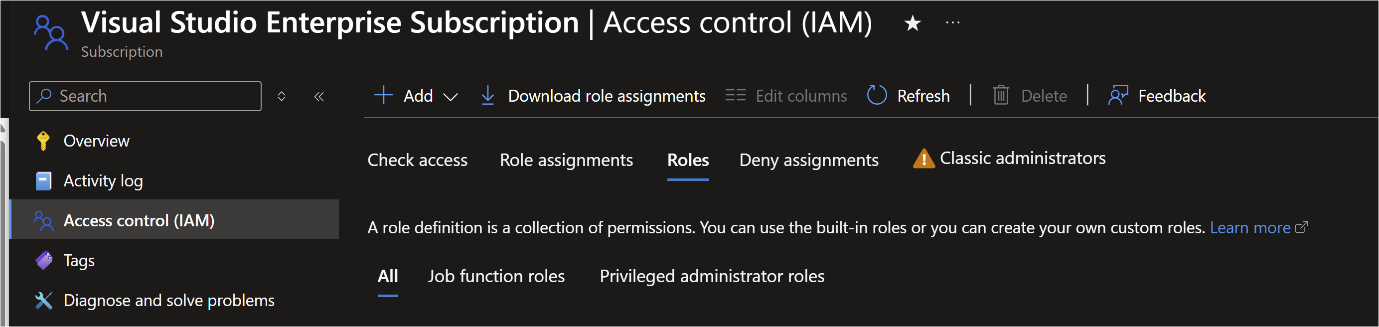This image shows the "Access control (IAM)" section of the Azure portal for a "Visual Studio Enterprise Subscription." The left sidebar includes navigation options like Overview, Activity log, Access control (IAM), Tags, and Diagnose and solve problems. The main pane displays tabs for Check access, Role assignments, Roles (selected), Deny assignments, and Classic administrators. There is a description explaining that a role definition is a collection of permissions, with options to view All roles, Job function roles, and Privileged administrator roles. There are also buttons for Add, Download role assignments, Refresh, Delete, and Feedback at the top.