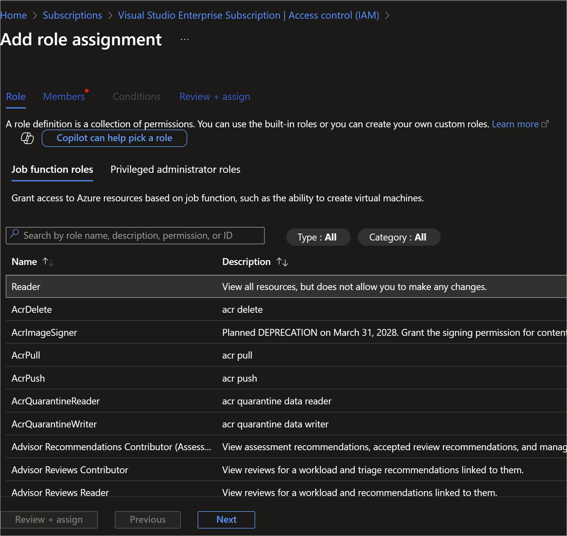 This image shows the "Add role assignment" screen in the Azure portal, specifically under "Access control (IAM)" for a Visual Studio Enterprise Subscription. The interface allows users to assign roles to manage access to Azure resources. Key elements: - Tabs at the top: **Role**, **Members**, **Conditions**, **Review + assign**. - A description explaining that a role definition is a collection of permissions. - A search bar to filter roles by name, description, permission, or ID. - Role list table with columns for **Name** and **Description** (e.g., Reader, AcrDelete, AcrPull). - Buttons at the bottom: **Review + assign**, **Previous**, and **Next** (with "Next" highlighted). - The interface uses a dark theme.